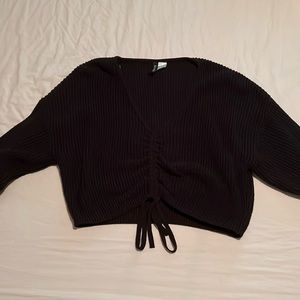 Ribbed sweater crop top. Adjustable front.